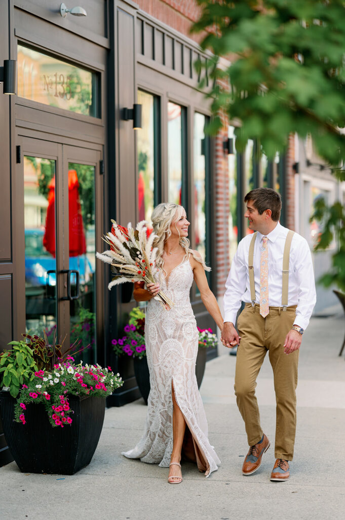 Happy couple ready to browse a top banquet hall venue with bar services 